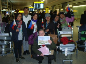 Pilgrims are greeted at London Heathrow Airport